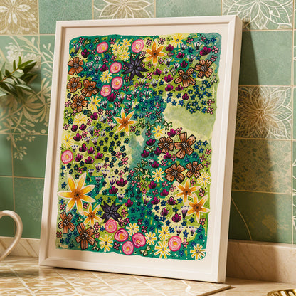 Framed colorful floral Bloom print by Joy and Fury Art against a tiled wall