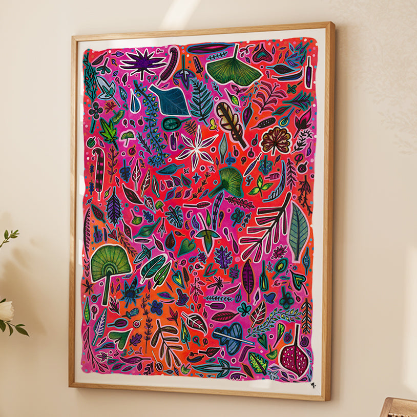 Framed colorful leaf pattern print by Joy and Fury Art on a light wall