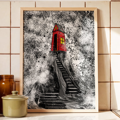 Framed red sea shack cliff print by Joy and Fury Art on a kitchen counter